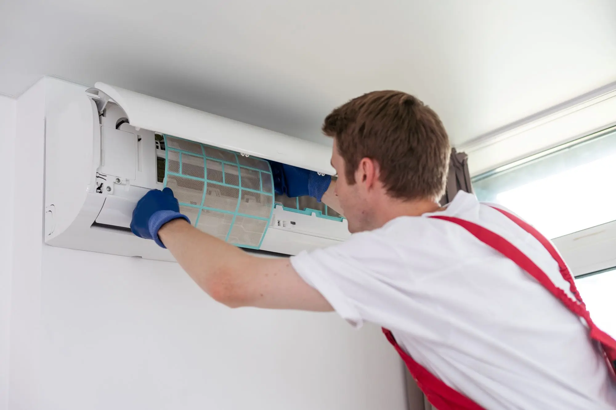 AC Repair & Service Gauteng AC technician servicing an air conditioning unit in Gauteng